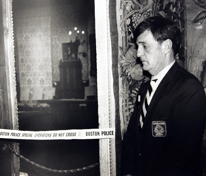 In this March 21, 1990 photo, a security guard stands outside the Dutch Room of the Isabella Stewart Gardner Museum, where robbers stole more than a dozen works of art in an early morning robbery in B ...