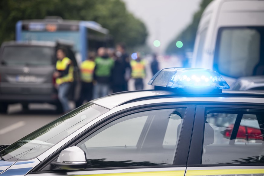 epa08477693 A police car&#039;s light flashes at a crime scene in Munich, Bavaria, Germany, 10 June 2020. The police announced via Twitter that according to the current state of investigation a car dr ...
