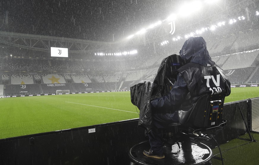 A cameramen films the Allianz Stadium in Turin, Italy, Sunday, Oct. 4, 2020 ahead of the scheduled Serie A soccer match between Juventus and Napoli. Napoli is likely to be handed a 3-0 loss by the Ita ...