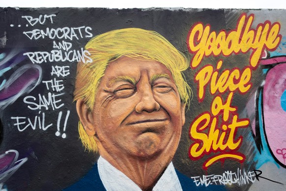 epa08815359 A view of a mural of current US President Donald J. Trump by street artist Eme Freethinker at the Mauerpark (Wall Park) in Berlin, Germany, 12 November 2020. EPA/HAYOUNG JEON