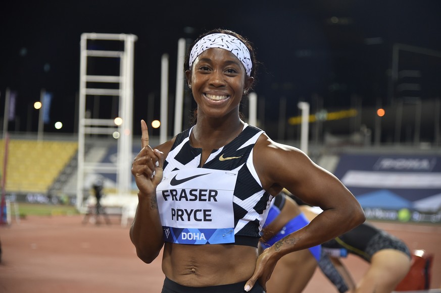 epa09234301 Shelly-Ann Fraser-Pryce of Jamaica celebrates after the 100m Women final race at the Doha Diamond League athletics meeting at Qatar Sports Club in Doha, Qatar, 28 May 2021. EPA/Noushad The ...