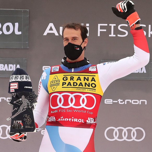 epa08897810 Winner Ramon Zenhaeusern of Switzerland celebrates on the podium for the Men&#039;s Slalom race at the FIS Alpine Skiing World Cup in Alta Badia, Italy, 21 December 2020. EPA/ANDREA SOLERO