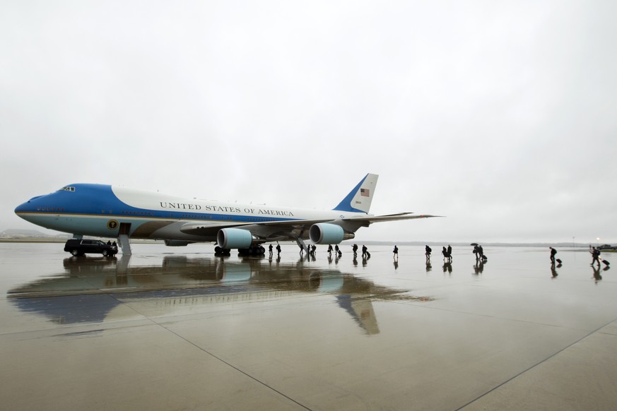 FILE - In this April 6, 2017, file photo, members of the White House press corps board Air Force One before the arrival of President Donald Trump at Andrews Air Force Base, Md. Trump says Air Force On ...