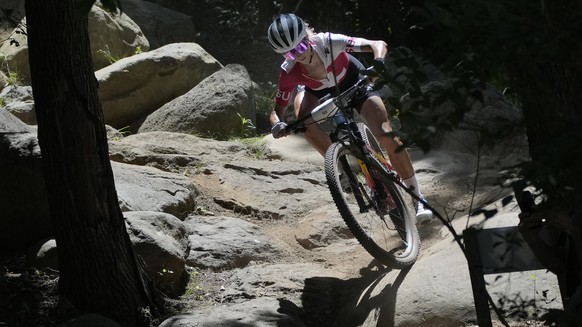 Jolanda Neff of Switzerland rides during a training for the Mountain Bike Cycling race at the 2020 Summer Olympics, Friday, July 23, 2021, in Izu, Japan. (AP Photo/Christophe Ena)