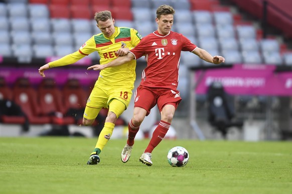Cologne&#039;s Ondrej Duda, left, and Bayern&#039;s Joshua Kimmich challenge for the ball during a German Bundesliga soccer match between Bayern Munich and 1.FC Cologne in Munich, Germany, Saturday, F ...