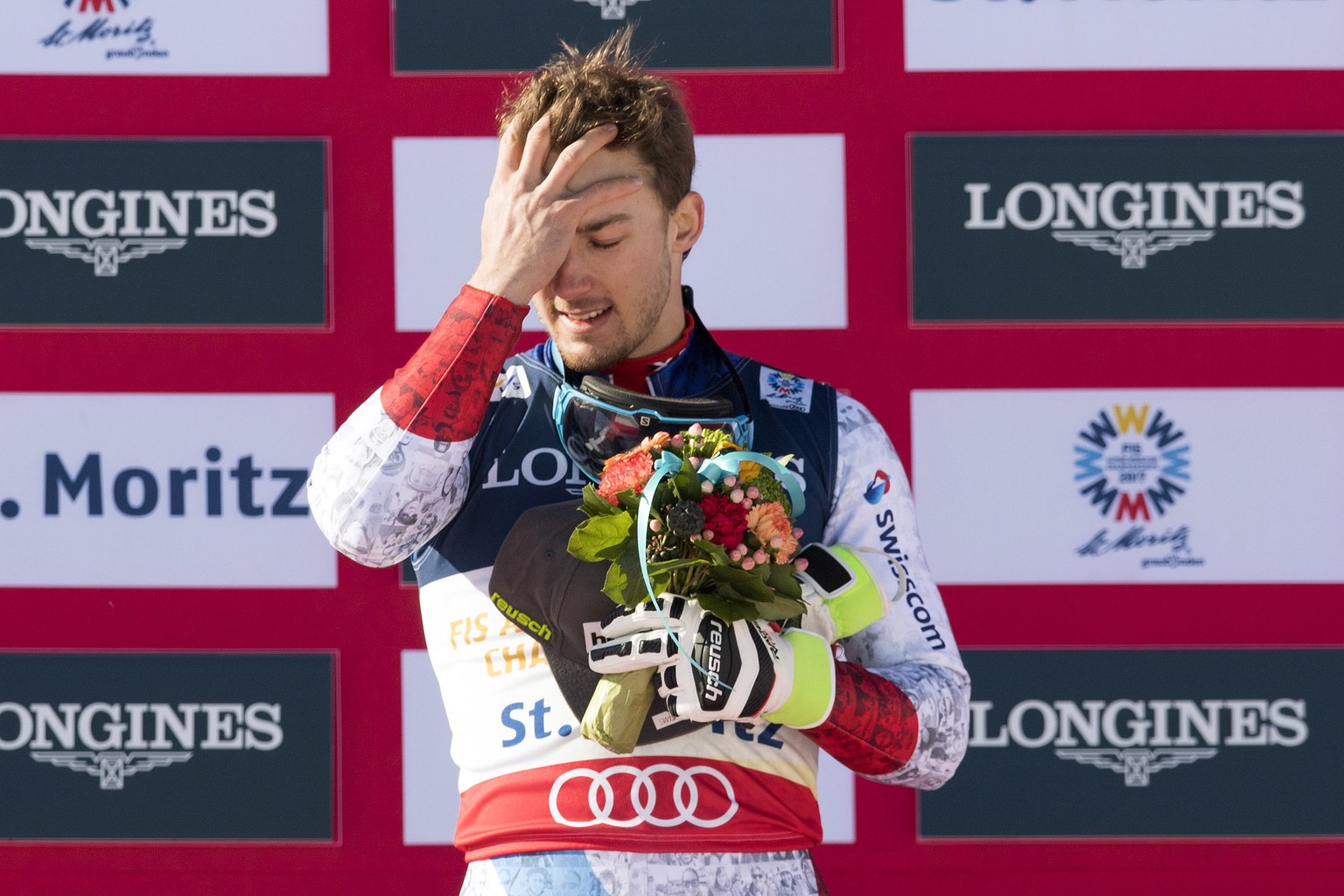 Gold medalist Luca Aerni of Switzerland reacts during the flower ceremony after the men&#039;s combined competition at the 2017 Alpine Skiing World Championships in St. Moritz, Switzerland, Monday, Fe ...