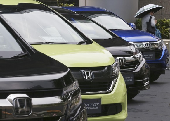 FILE - In this July 31, 2019, file photo, Honda cars are displayed at the automaker&#039;s headquarters in Tokyo. The Japanese automaker sank deeper into losses for the fiscal quarter ended in March,  ...