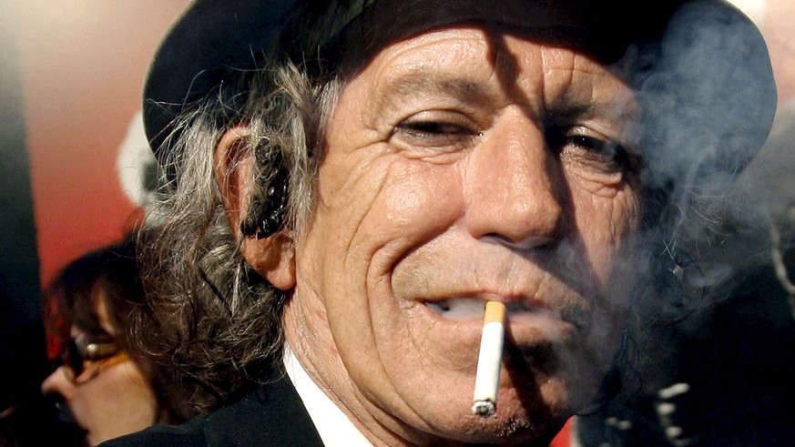 epa07223241 (FILE) - A file picture dated 30 March 2008 shows British Rolling Stones guitarist Keith Richards smoking a cigarette at the Ziegfeld Theater in New York, USA (reissued 11 December 2018).  ...