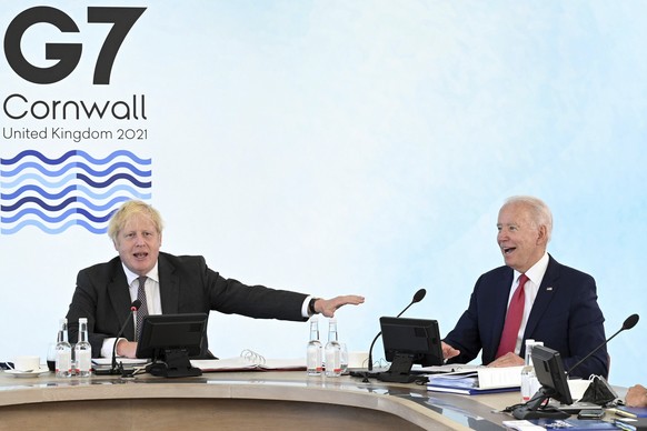 Britain&#039;s Prime Minister Boris Johnson, left, and US President Joe Biden during the G7 summit in Cornwall, England, Saturday June 12, 2021. (Leon Neal/Pool via AP)