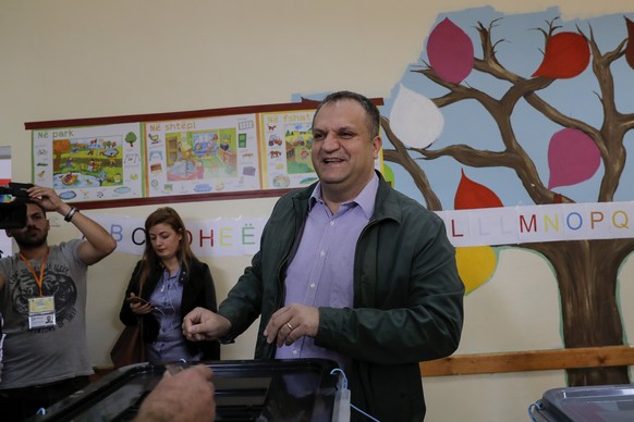 epa06282030 Shpend Ahmeti, acting mayor of Kosovo&#039;s capital Pristina and member of the biggest opposition party Self-Determination (Vetevendosje), smiles as he casts a ballot at a polling station ...