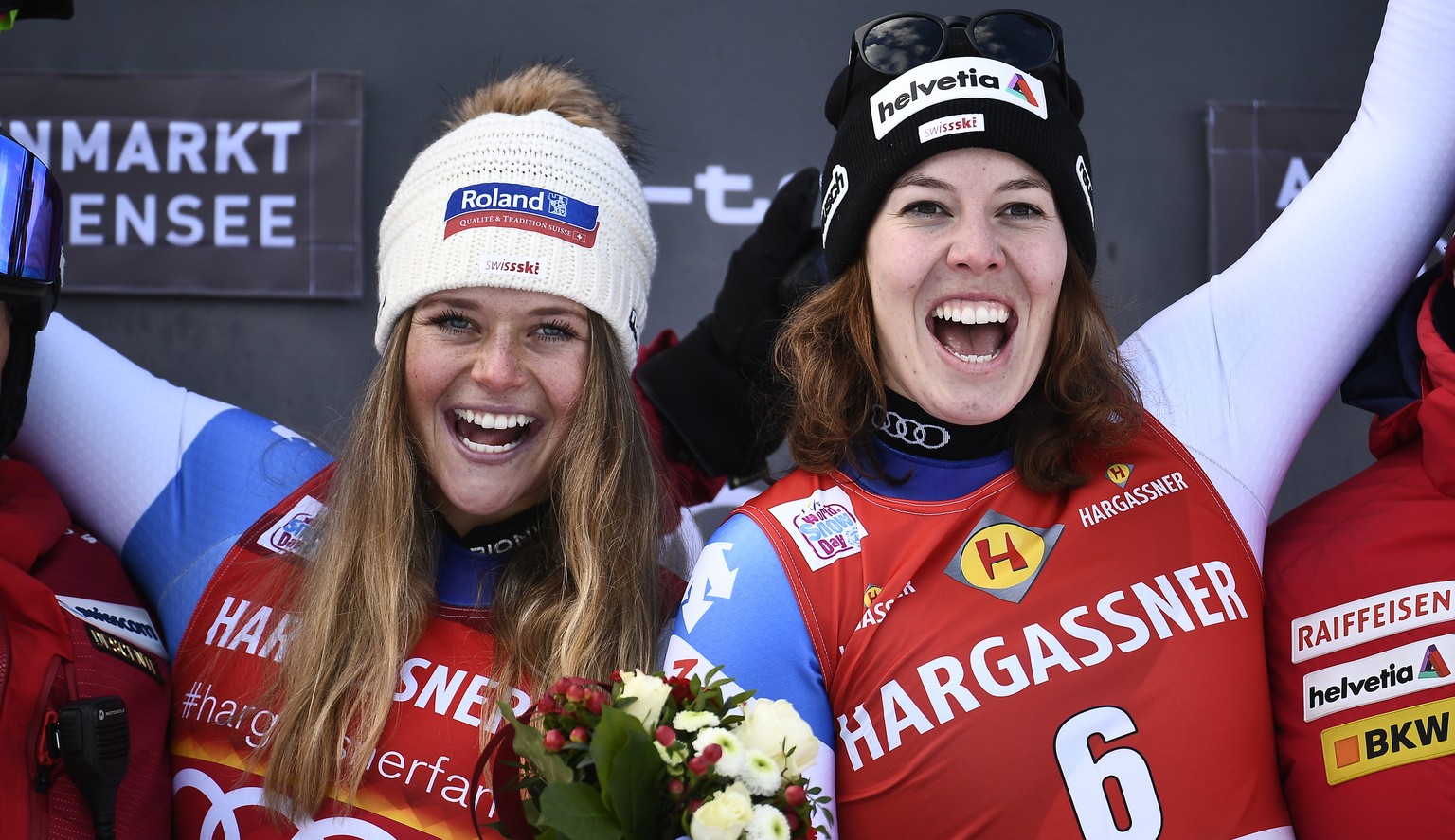 epa08119312 Winner Corinne Suter (L) of Switzerland and third placed Michelle Gisin of Switzerland celebrate on the podium after the women&#039;s Downhill race of the FIS Alpine Skiing World Cup in Al ...