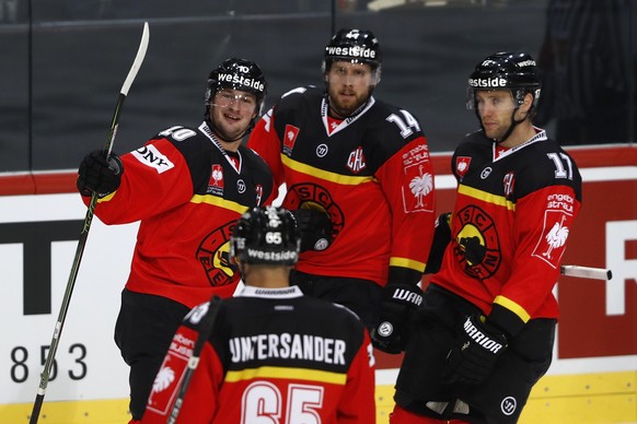 Bern&#039;s Tristan Scherwey, back left, celebrates with teammates after scoring the 2-1 during a Champions Hockey League round of 32, 2nd leg match between SC Bern of Switzerland and Red Bull Salzbur ...