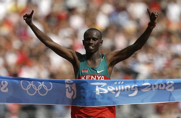 Kenyan Samuel Kamau Wansiru reacts after winning the men&#039;s marathon at the Beijing 2008 Olympics in Beijing, Sunday, Aug. 24, 2008. (KEYSTONE/Peter Klaunzer)