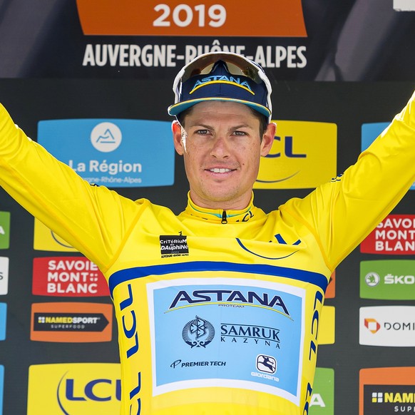 epa07652275 Danish rider Jakob Fuglsang (L) of the Astana Pro Team celebrates on the podium after winning the 71st Criterium du Dauphine UCI ProTour cycling race following the 8th stage over 113.5km b ...