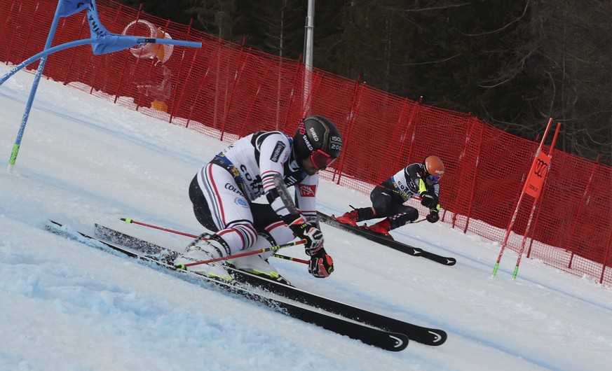 France&#039;s Mathieu Faivre, left, and Croatia&#039;s Filip Zubcic speed down the course during a parallel slalom, at the alpine ski World Championships, in Cortina d&#039;Ampezzo, Italy, Tuesday, Fe ...