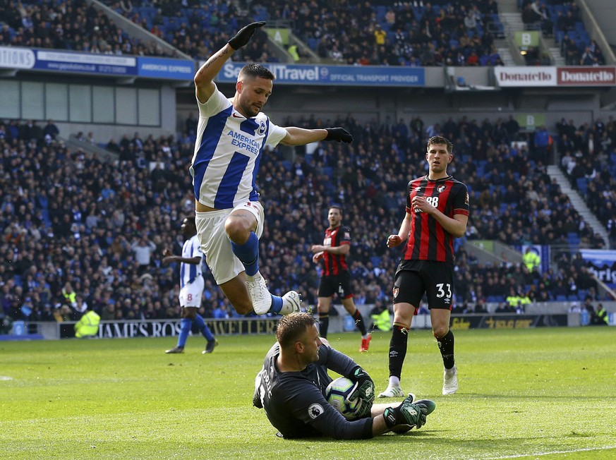 Bournemouth goalkeeper Artur Boruc saves from Brighton &amp; Hove Albion&#039;s Florin Andone during their English Premier League soccer match at the AMEX Stadium, Brighton, England, Saturday, April 1 ...