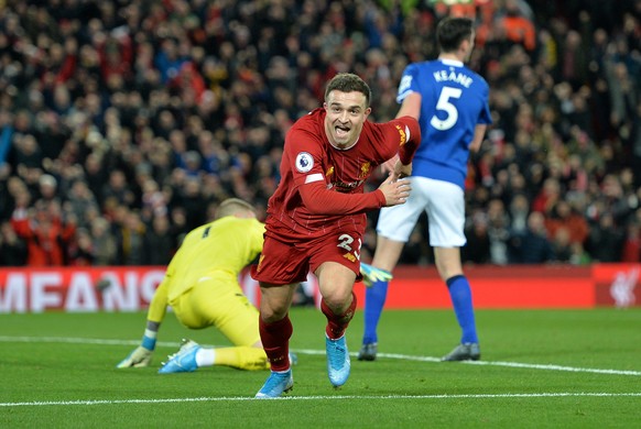 epa08044984 Xherdan Shaqiri of Liverpool celebrates after scoring the 2-0 during the English Premier League soccer match between Liverpool FC and Everton in Liverpool, Britain, 04 December 2019. EPA/P ...
