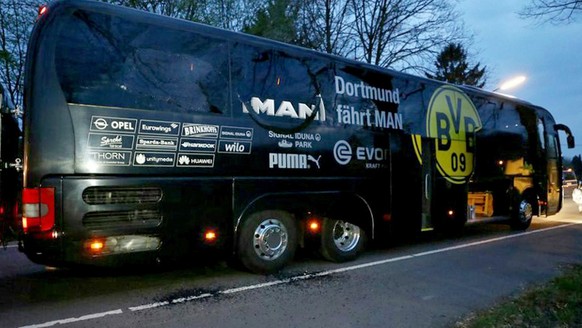 epa06169844 (FILE) - The damaged team bus of Borussia Dortmund stands on a street after it was hit by three explosions in Dortmund, Germany, 11 April 2017 (reissued 29 August 2017). The Dortmund prose ...