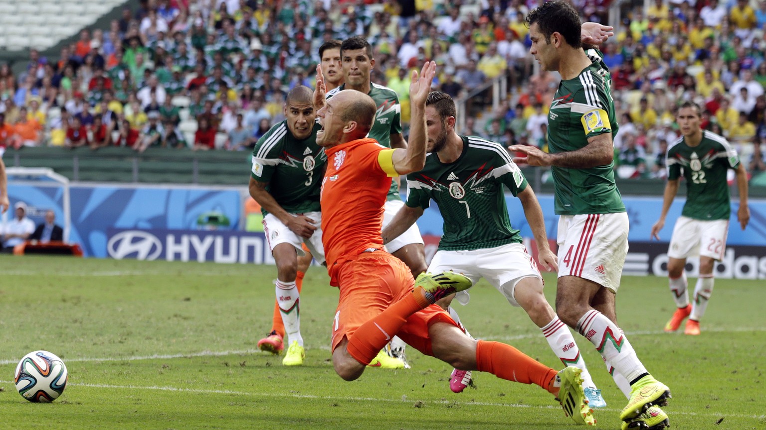 AP10ThingsToSee - Netherlands&#039; Arjen Robben, center, goes down to win a penalty during the World Cup round of 16 soccer match between the Netherlands and Mexico at the Arena Castelao in Fortaleza ...