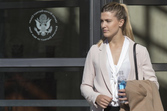 Tennis star Eugenie Bouchard leaves Brooklyn Federal court, Wednesday, Feb. 21, 2018, in New York. Bouchard testified during her negligence lawsuit against the United States Tennis Association that a  ...