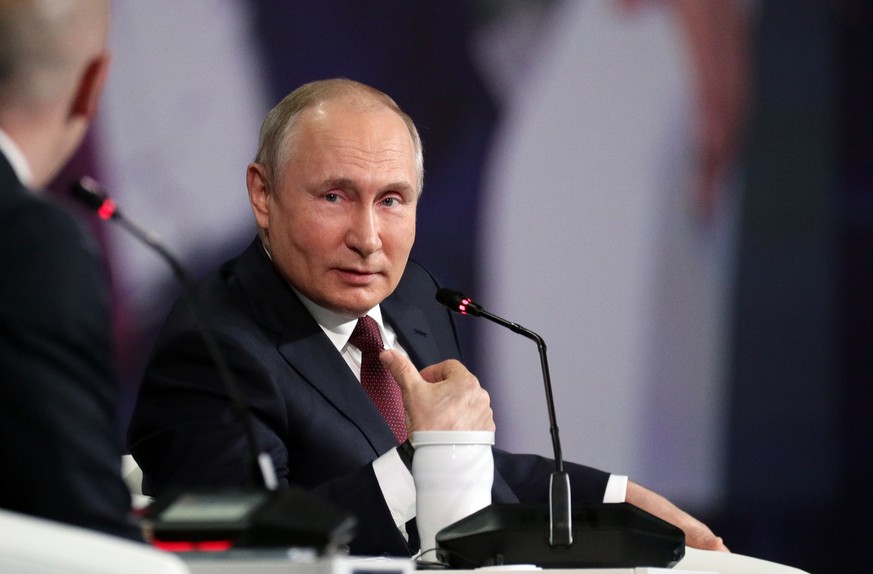 epa09247820 Russian President Vladimir Putin attends a plenary session of the St. Petersburg International Economic Forum (SPIEF) in St. Petersburg, Russia, 04 June 2021. The 24th St.Petersburg Intern ...