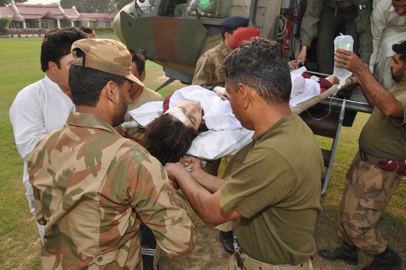 epa06635513 (FILE) - A handout photo made available by the Inter-Services Public Relations (ISPR) shows Army soldiers shifting Malala Yousafzai, a Pakistani teenager who won international praise for a ...