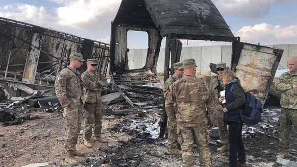 U.S. Soldiers stand amid damage at a site of Iranian bombing at Ain al-Asad air base, in Anbar, Iraq, Monday, Jan. 13, 2020. Ain al-Asad air base was struck by a barrage of Iranian missiles on Wednesd ...