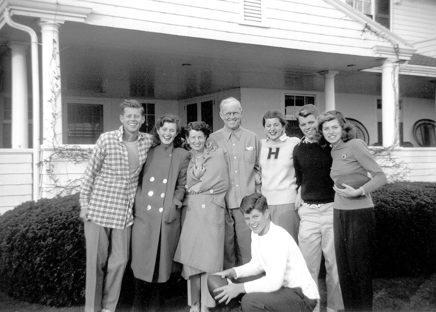 In this circa 1948 photo provided by the Kennedy Family Collection, courtesy of the John F. Kennedy Library Foundation, members of the Kennedy family pose for a photo in Hyannis Port, Mass. They are f ...