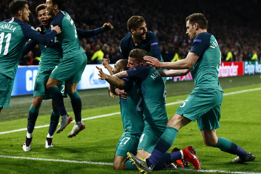 Tottenham&#039;s Lucas Moura, center, kneeling, celebrates after scoring his side&#039;s third goal during the Champions League semifinal second leg soccer match between Ajax and Tottenham Hotspur at  ...