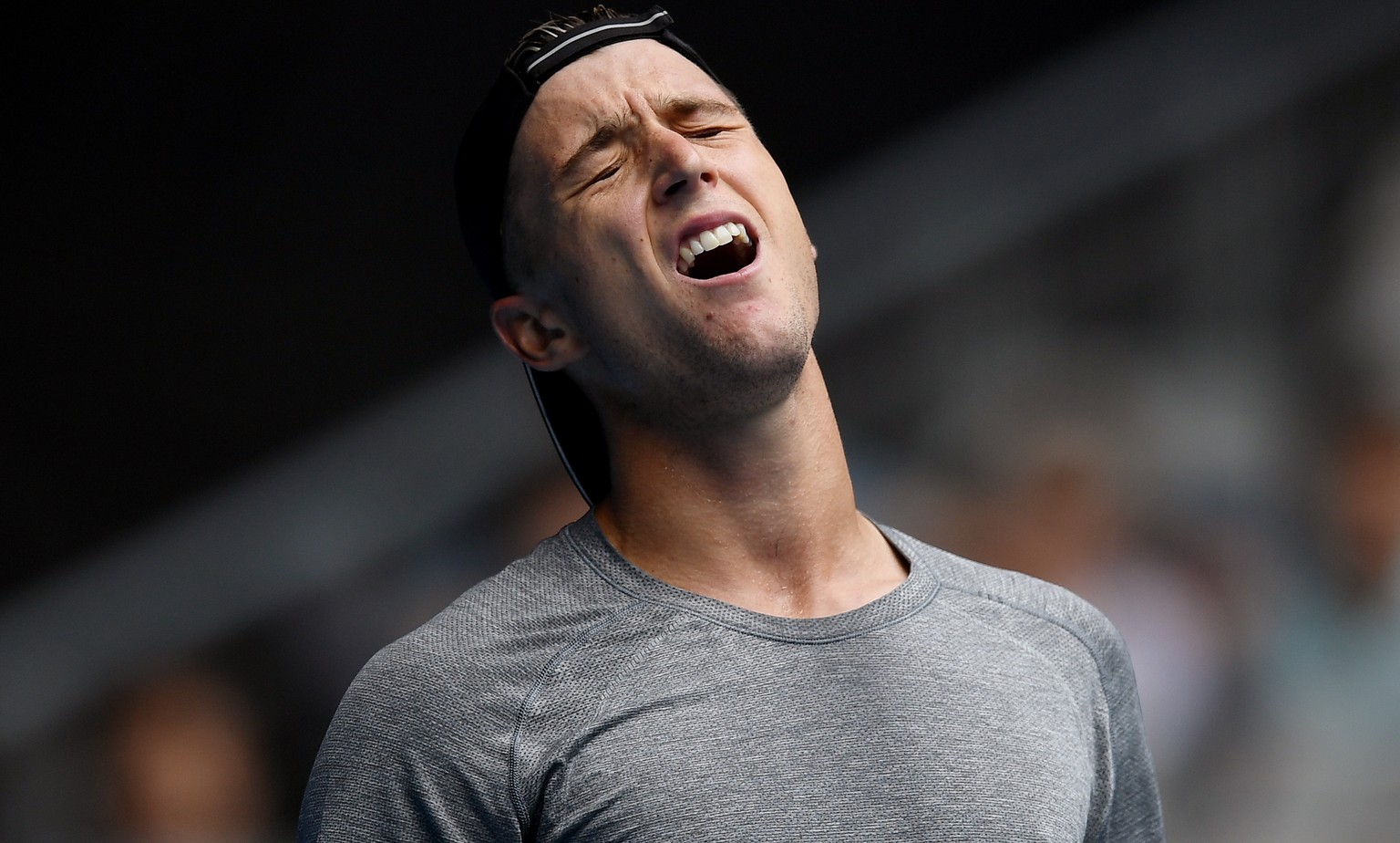 epa08142973 Andrew Harris of Australia reacts while playing against Matteo Berrettini of Italy during a first round match on day one of the Australian Open tennis tournament at Melbourne Arena in Melb ...