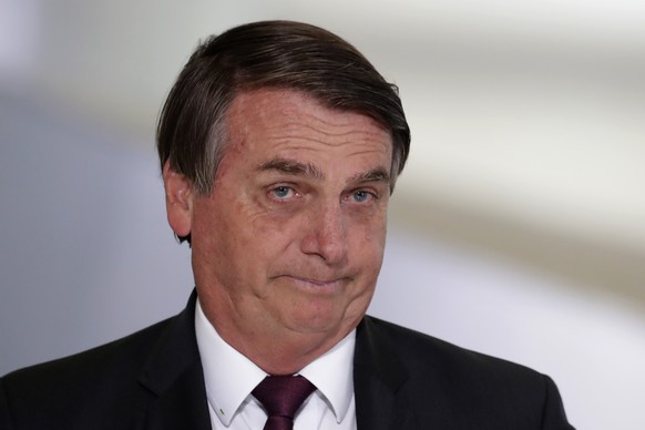 Brazil&#039;s President Jair Bolsonaro for a ceremony on digital social savings and the payment of aid to families amid the COVID-19 pandemic, in Brasilia, Brazil, Wednesday, Nov. 4, 2020. (AP Photo/E ...