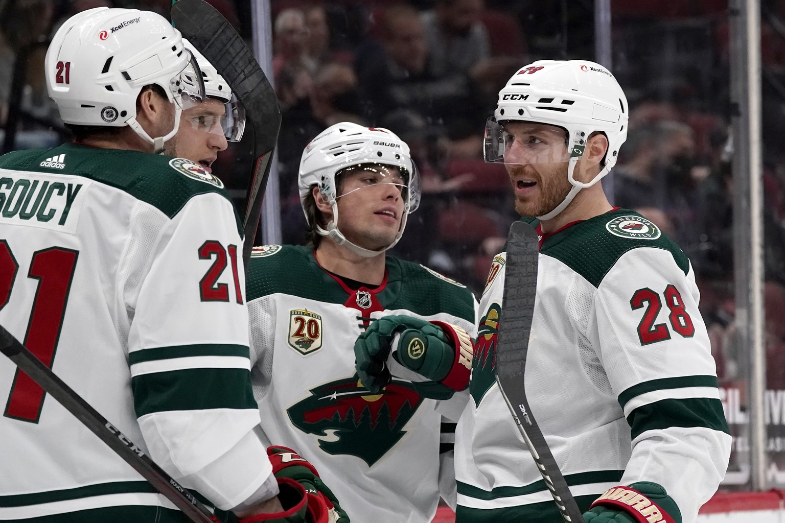 Minnesota Wild left wing Kevin Fiala, second from right, celebrates his goal against the Arizona Coyotes with Wild defenseman Carson Soucy (21), center Nico Sturm, second from left, and defenseman Ian ...