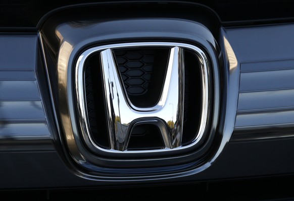 FILE - In this Jan. 11, 2016, file photo, the logo of Honda Motor Co. is seen on a Honda vehicle at the Japanese automaker&#039;s headquarters in Tokyo. Honda, on Tuesday, Aug. 4, 2020, is recalling o ...