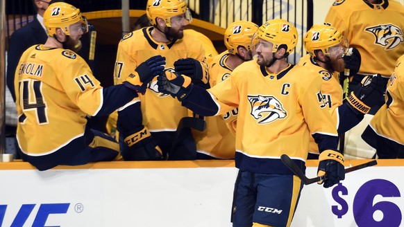 Nashville Predators defenseman Roman Josi (59) is congratulated after scoring a goal against the Tampa Bay Lightning during the first period of an NHL hockey game Tuesday, April 13, 2021, in Nashville ...