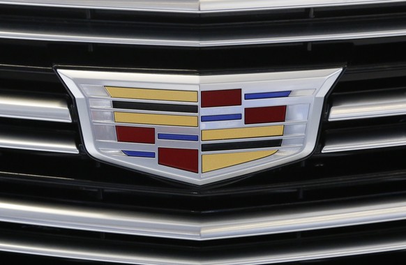 FILE - This Thursday, Feb. 11, 2016, file photo shows the Cadillac logo, a General Motors Co. brand, on display on a vehicle at the Pittsburgh International Auto Show in Pittsburgh. The U.S. governmen ...