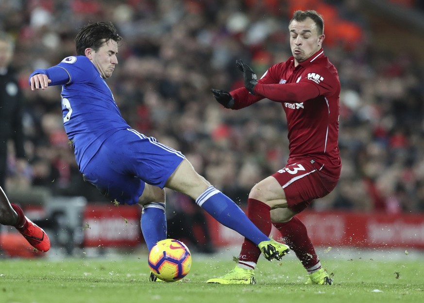 Leicester City defender Ben Chilwell, left, challenges for the ball with Liverpool midfielder Xherdan Shaqiri, during the English Premier League soccer match between Liverpool and Leicester City, at A ...