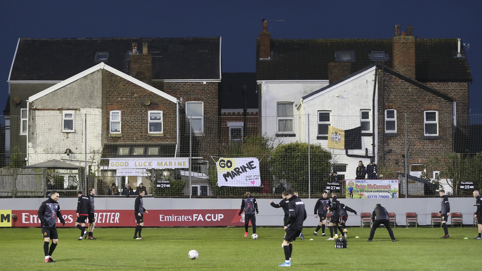 Marine players warm up prior to the English FA Cup third round soccer match between Marine and Tottenham Hotspur at Rossett Park stadium in Crosby, Liverpool, Sunday, Jan. 10, 2021. (Martin Rickett/Po ...