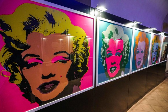 epa08768750 Portraits of US actress Marilyn Monroe by US artist Andy Warhol are on display in the Andy Warhol exhibition, entitled &#039;Super Pop,&#039; in Nichelino, near Turin, Italy, 23 October 20 ...