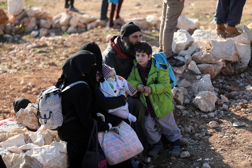 epa08188237 Syrian people gather near the Syrian-Turkish borders during a protest northwestern of Idlib, Syria, 02 February 2020. According to local reports, some 500 people joined the protest titled  ...