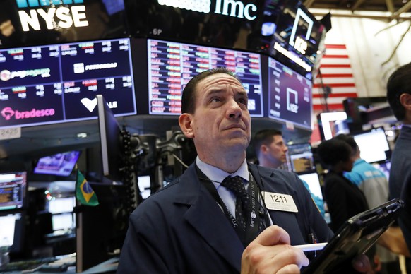 FILE- In this Dec. 6, 2018, file photo trader Tommy Kalikas works on the floor of the New York Stock Exchange. The U.S. stock market opens at 9:30 a.m. EST on Tuesday, Dec. 11. (AP Photo/Richard Drew, ...