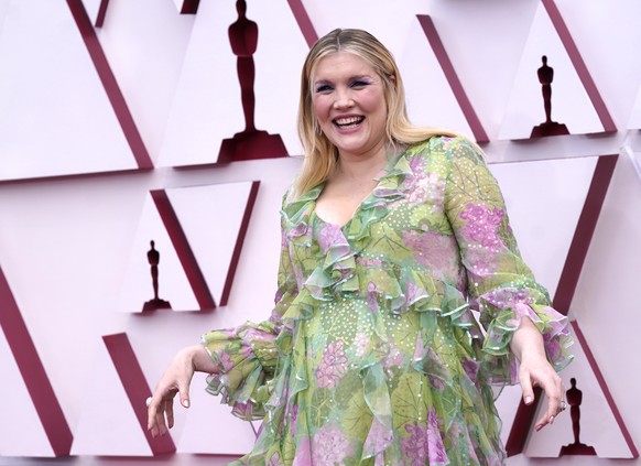 epa09159779 Emerald Fennell arrives for the 93rd annual Academy Awards ceremony at Union Station in Los Angeles, California, USA, 25 April 2021. The Oscars are presented for outstanding individual or  ...
