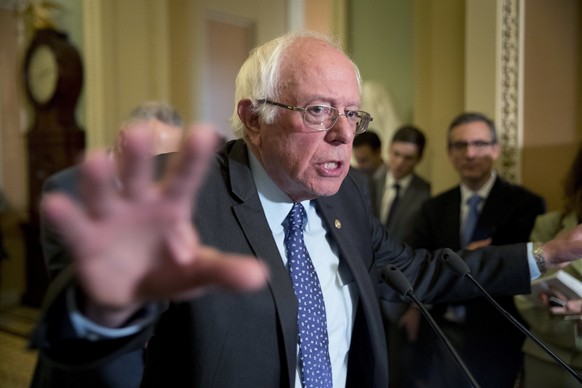 FILE - In this Oct. 17, 2017, file photo, Sen. Bernie Sanders, I-Vt., speaks to reporters on Capitol Hill in Washington, following Senate policy luncheons. Senators often talk about Sanders in diploma ...