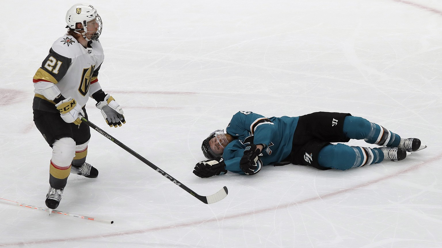 San Jose Sharks center Joe Pavelski, right, lies on the ice next to Vegas Golden Knights center Cody Eakin during the third period of Game 7 of an NHL hockey first-round playoff series in San Jose, Ca ...