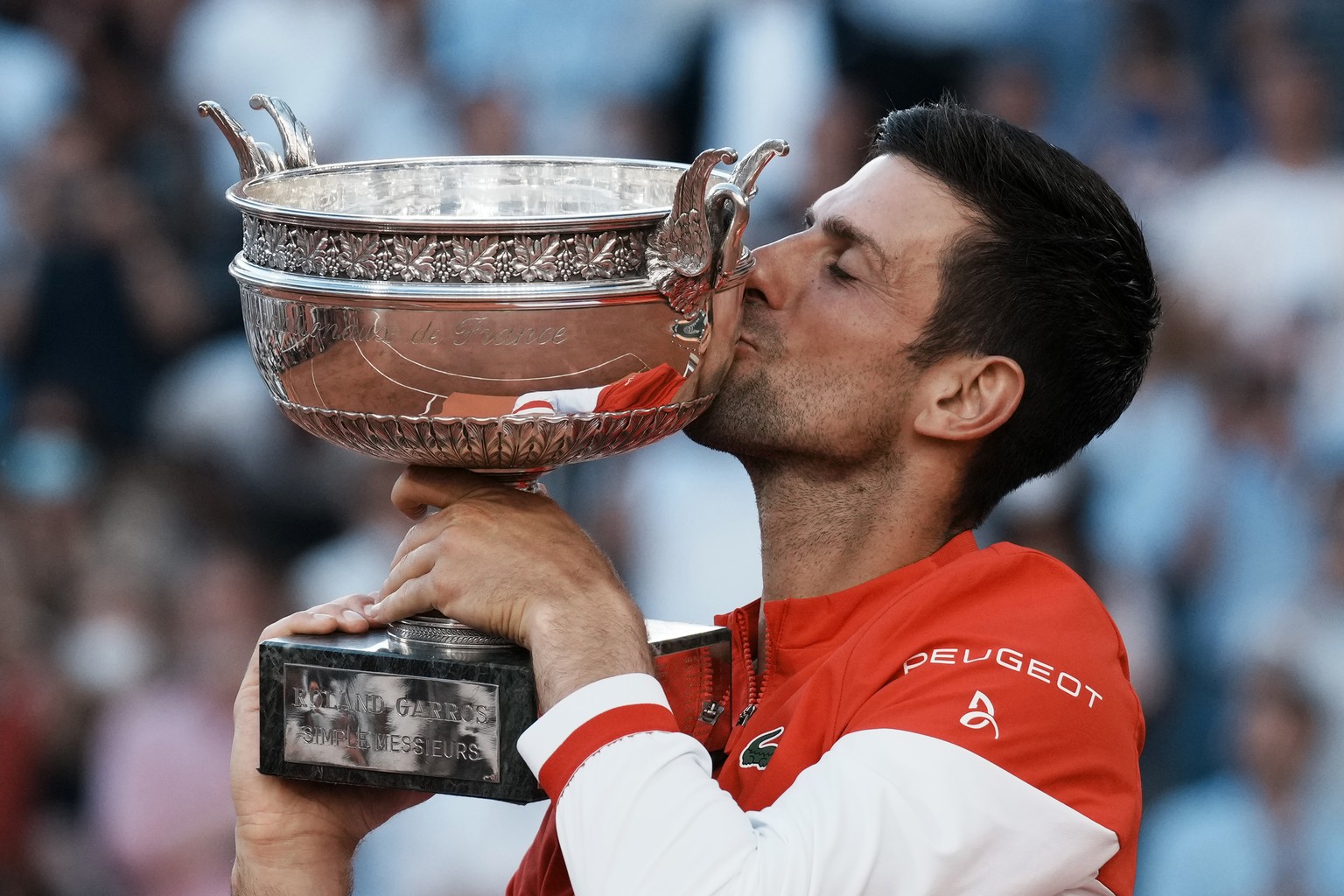 Serbia&#039;s Novak Djokovic kisses the cup after defeating Stefanos Tsitsipas of Greece in their final match of the French Open tennis tournament at the Roland Garros stadium Sunday, June 13, 2021 in ...