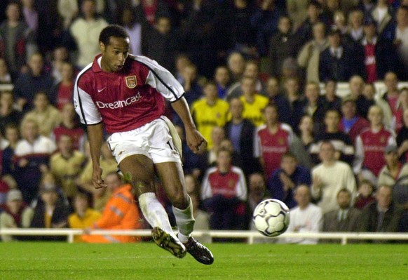 FILE - In this Wednesday Oct. 24, 2001 file photo, Thierry Henry scores Arsenal&#039;s third goal against Real Mallorca during their Champions League soccer match played at Highbury, London. Arsene We ...