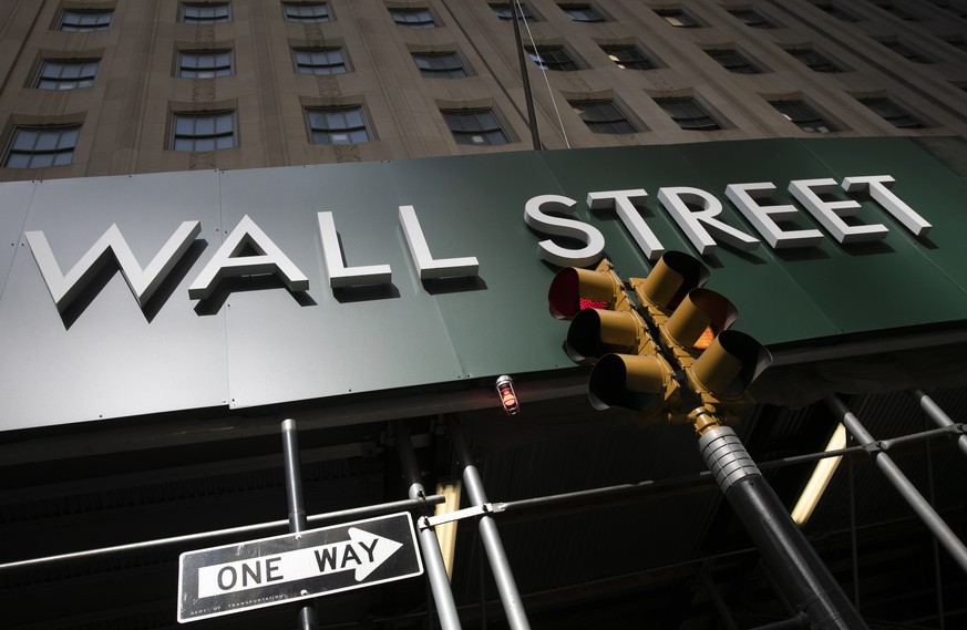 FILE - In this June 16, 2020, file photo, a sign for a Wall Street building is shown in New York. Stocks are opening higher as Wall Street&#039;s tech-driven rally continues to notch gains. The benchm ...