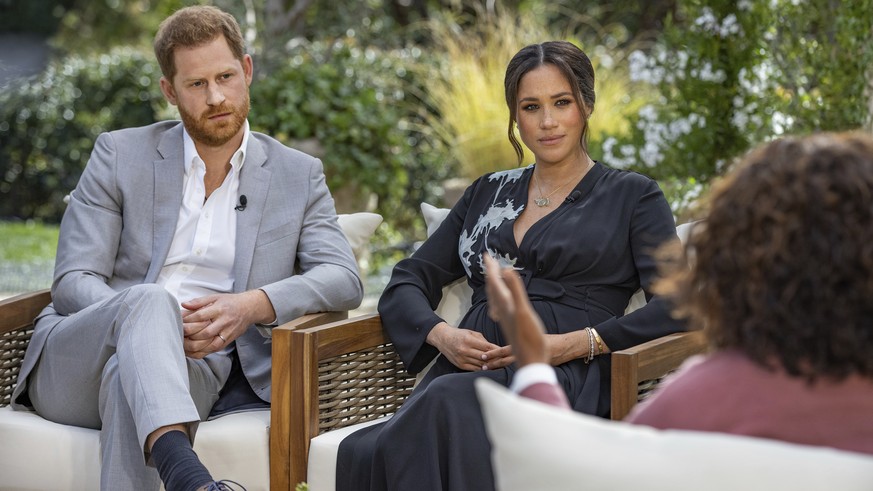 This image provided by Harpo Productions shows Prince Harry, from left, and Meghan, The Duchess of Sussex, in conversation with Oprah Winfrey.