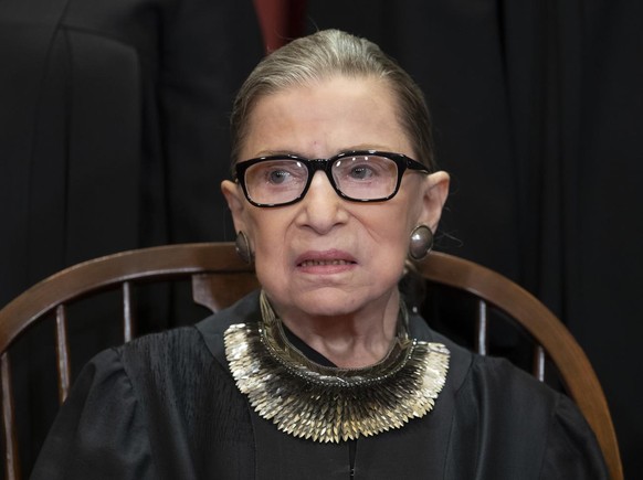 FILE - In this Nov. 30, 2018 file photo, Associate Justice Ruth Bader Ginsburg, nominated by President Bill Clinton, sits with fellow Supreme Court justices for a group portrait at the Supreme Court B ...