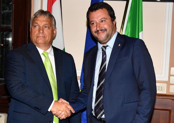epa06979149 Italian Interior Minister Matteo Salvini (R) shakes hand with Hungarian Prime Minister, Viktor Orban (L), during their meeting at the Prefecture of Milan, Italy, 28 August 2018. EPA/DANIEL ...