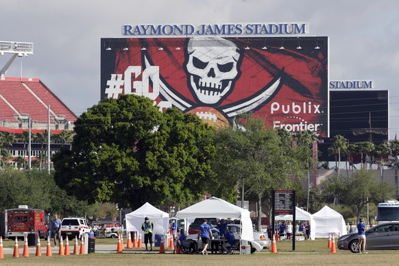Medical personnel from BayCare test people for the coronavirus in the parking lot outside Raymond James Stadium Wednesday, March 25, 2020, in Tampa, Fla. Testing is being done by appointment only. (AP ...
